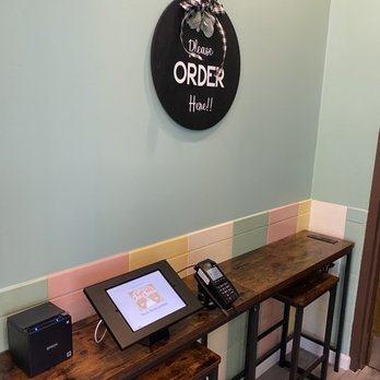 Twistee Treat LBV - a desk with a phone and printer - Ice Cream & Frozen Yogurt Near Me - Orlando, Florida