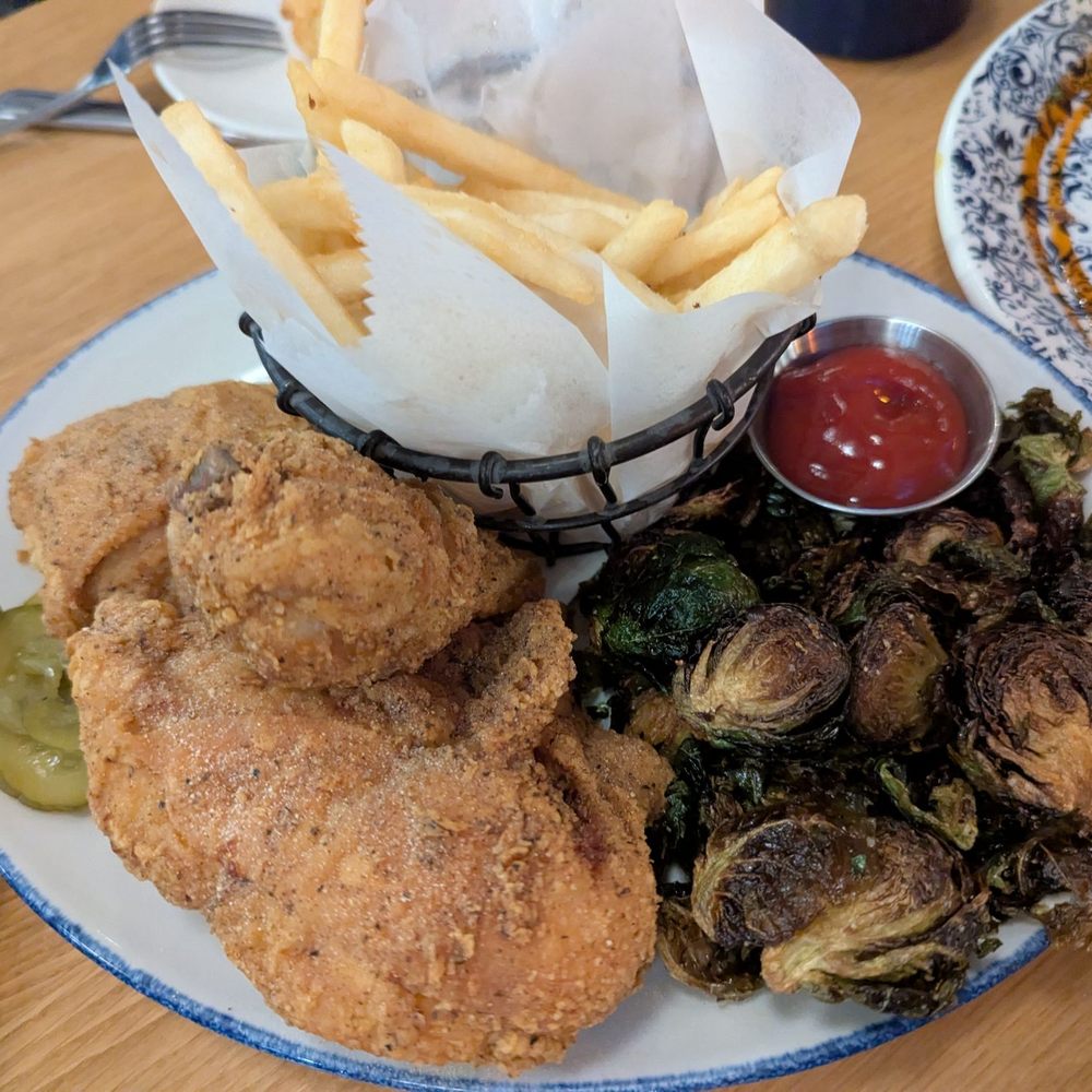 Tupelo Honey Southern Kitchen & Bar - Fried Chicken with Brussels Sprouts and French Fries - New American Near Me - Frisco, Texas Tupelo Honey Southern Kitchen & Bar - Fried Chicken with Brussels Sprouts and French Fries - New American Near Me - Frisco, Texas