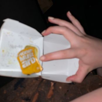 McDonald's - a person holding a donut in their hand - Fast Food Near Me - Saratoga Springs, Utah McDonald's - a person holding a donut in their hand - Fast Food Near Me - Saratoga Springs, Utah