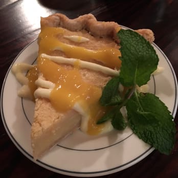 The Floridian - Buttermilk pie with champagne mango sauce - Southern Near Me - Saint Augustine, Florida The Floridian - Buttermilk pie with champagne mango sauce - Southern Near Me - Saint Augustine, Florida