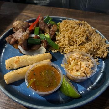 Zeke's Kitchen & Bar - Griot Tasso plate w/ yucca fries - New American Near Me - Smyrna, Georgia Zeke's Kitchen & Bar - Griot Tasso plate w/ yucca fries - New American Near Me - Smyrna, Georgia