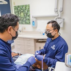 Schneider Family Dentistry - Dr Tom treating a patient