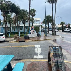 Flagler Avenue Pizza Company - Outside bench and street view from the restaurant.