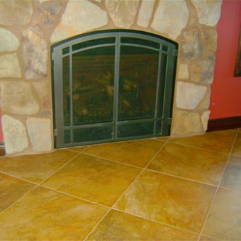 Pat's Construction - a fireplace in a living room - General Contractors Near Me