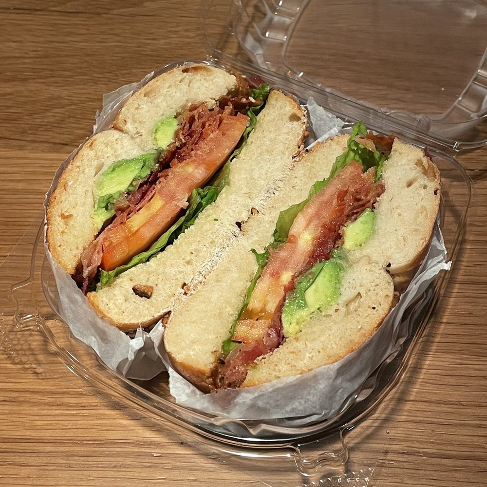 Ess-a-Bagel Time Out Market New York - ows a sandwich in a plastic container - Bagels Near Me - Brooklyn, New York