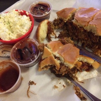 Stan's Bar-B-Q - Pulled pork sandwich crumbling after cutting in half and side potato salad. - Barbeque Near Me - Issaquah, Washington