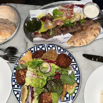 Shuka - Niman Ranch Sirloin Steak Kebab (top), Fattoush Salad with Fried Halloumi - Mediterranean Near Me - New York, New York Shuka - Niman Ranch Sirloin Steak Kebab (top), Fattoush Salad with Fried Halloumi - Mediterranean Near Me - New York, New York