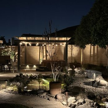 Be The Light Outdoor Lighting - Backyard patio with pond in foreground. - Electricians Near Me Be The Light Outdoor Lighting - Backyard patio with pond in foreground. - Electricians Near Me