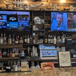 Beautiful bar with a couple of TVs going