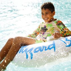 Disney's Blizzard Beach Water Park - Blizzard Beach guest tubing in water park.
