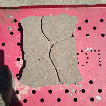 Johnson Contracting - a person standing on a pink sidewalk - Landscaping Near Me