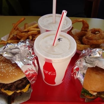 Red Mill Burgers - Double Bacon Deluxe w/ Cheese, Verde Burger, onion rings, french fries, and sparkling/plain lemonade - Burgers Near Me - Seattle, Washington Red Mill Burgers - Double Bacon Deluxe w/ Cheese, Verde Burger, onion rings, french fries, and sparkling/plain lemonade - Burgers Near Me - Seattle, Washington