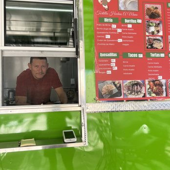 Taqueria El Zarape - a man looking out the window of a food truck - Mexican Near Me - Tucson, Arizona Taqueria El Zarape - a man looking out the window of a food truck - Mexican Near Me - Tucson, Arizona