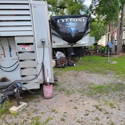 Quality RV Resorts - Trash under campers that look like they live there.