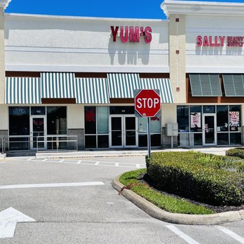 Yum's - a stop sign in front of a store - Chinese Near Me - Merritt Island, Florida Yum's - a stop sign in front of a store - Chinese Near Me - Merritt Island, Florida