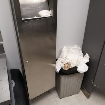 Remedy Cafe - a trash can in a public restroom - Indian Near Me - Edmonton, Alberta