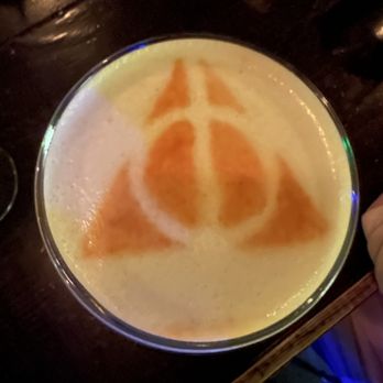 Spirits Wine Provisions - Deathly Hallows symbol on top of cocktail - Beer, Wine & Spirits Near Me - Arvada, Colorado Spirits Wine Provisions - Deathly Hallows symbol on top of cocktail - Beer, Wine & Spirits Near Me - Arvada, Colorado