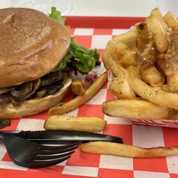 Hamburger with mushrooms and fries