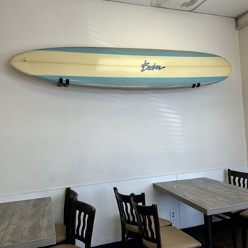 Rice Things - a surfboard mounted on the wall of a restaurant - Japanese Near Me - Redondo Beach, California