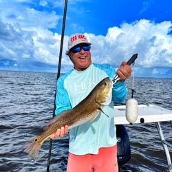 Captain Travis Blucher Charters - When the redfish bite is hot in Cedar Key we can't help but smile!