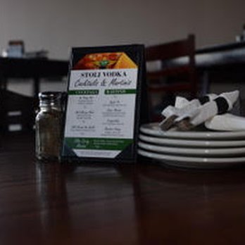 Lake Street Pub - a menu and plates on a table - New American Near Me - Roselle, Illinois