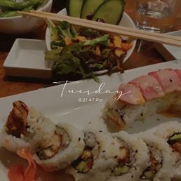 Sushi roll, cucumber salad and edamame