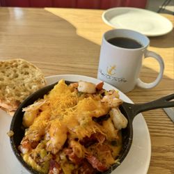 Augie's on the Bay - Shrimp and grits.... Really flavorful. No boring, bland grits here. Lots of cheesy flavor and big shrimp