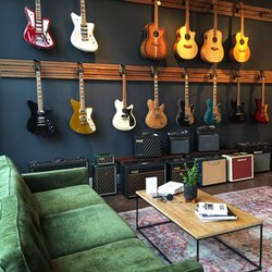 The Sound Parcel Music Showroom - Guitar wall at The Sound Parcel Music Showroom.