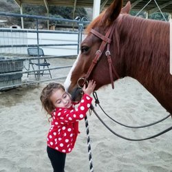 Still Water Ranch Oc - Our youngest student thanking Scarlet for a great ride