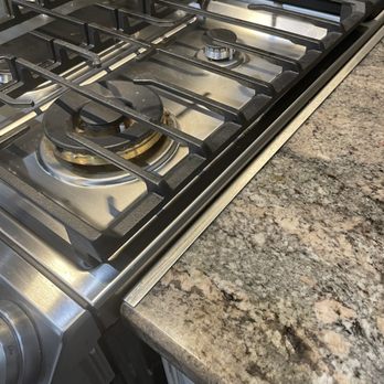 Abt - metal clamp added when granite edge was shaved to fit stove - Electronics Near Me - Glenview, Illinois