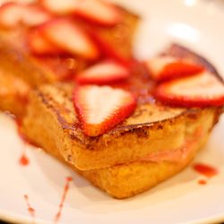 The Brunch House of Augusta - Strawberry stuffed French toast served with homemade strawberry syrup!