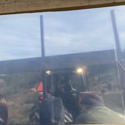 Riding the hayride. Plastic barriers for Covid precaution
