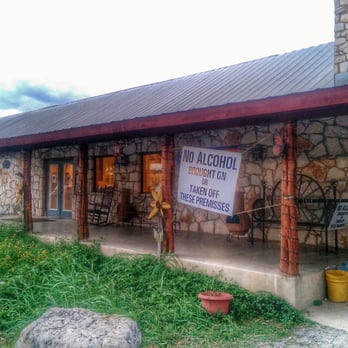 House Pasture Cattle - a stone building with a metal roof - Steakhouses Near Me - Concan, Texas