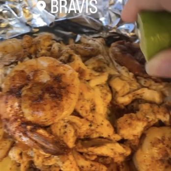 Bravis - Pineapple Bowl- hallowed out pineapple, rice, peppers, onions, chicken, shrimp and teriyaki drizzle. With some lime juice - Mexican Near Me - Shakopee, Minnesota
