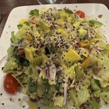 Cahill Bistro - Ensalada Andina - Organic baby kale lettuce with quinoa, tomatoes, red onion, pistachios and homemade citrus avocado vinaigrette - Latin American Near Me - Edina, Minnesota