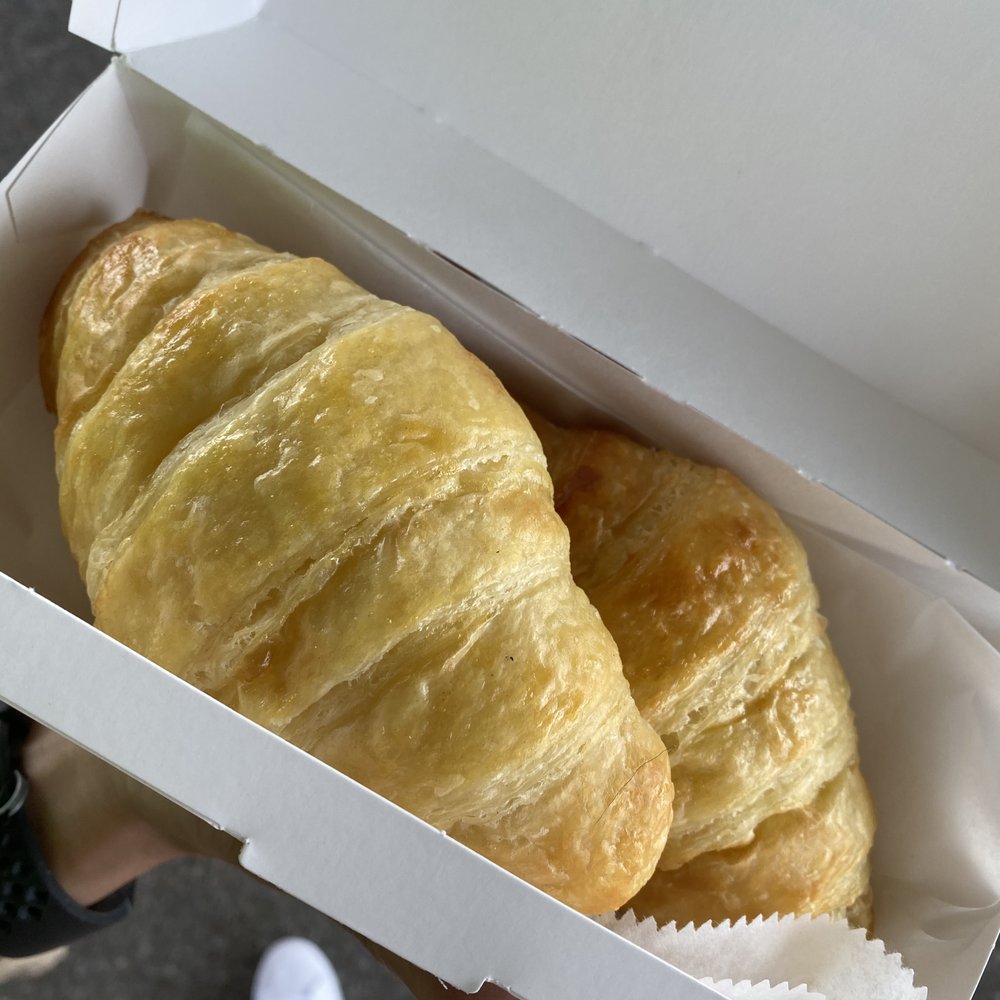 two croissants in a box two croissants in a box