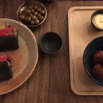 Pagu - Squid ink oyster bao on the left and curry crab croquetas on the right - Japanese Near Me - Cambridge, Massachusetts