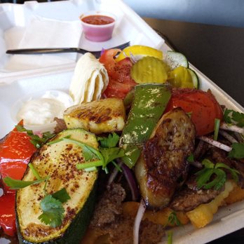 Sofia’s Doner Kebab Express - Slices of meat and a few vegetables on top of a ton of fries - Turkish Near Me - West Jordan, Utah