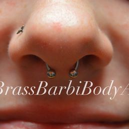 Nose piercing, septum piercing Nose piercing, septum piercing