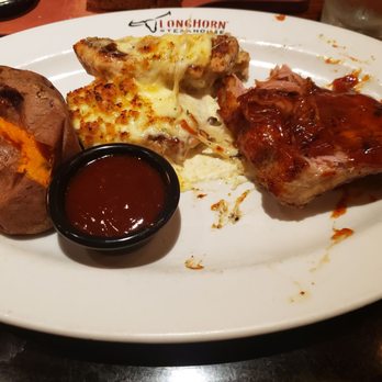 LongHorn Steakhouse - 9oz. Parmesan Crusted Chicken with Half-Rack Baby Back Ribs (half of the ribs were eaten-yiu get much more) - American Near Me - Roanoke, Virginia LongHorn Steakhouse - 9oz. Parmesan Crusted Chicken with Half-Rack Baby Back Ribs (half of the ribs were eaten-yiu get much more) - American Near Me - Roanoke, Virginia