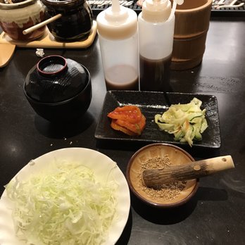 Koromo - Miso soup, pickled daikon kimchee and dalted cabbage cucumbers, shredded radish (Katsu Curry plate not shown) garlic and house dressing - Japanese Near Me - Aiea, Hawaii