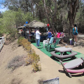 Mega Arte Riding Academy - Broad view of party area and ranch, not green as show, broken furniture, and will provide up close view of chairs and canopies. - Horseback Riding Near Me - Escondido, California