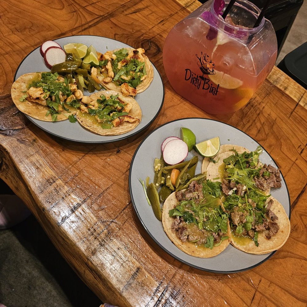 Tailfeather Kitchen - two plates of tacos on a table - Pizza Near Me - Hayward, California Tailfeather Kitchen - two plates of tacos on a table - Pizza Near Me - Hayward, California