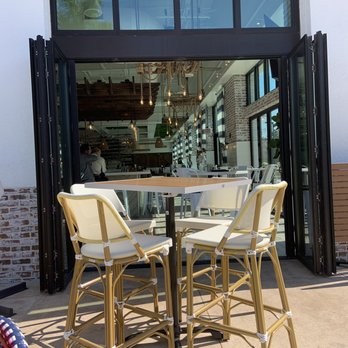The Hampton Social - Naples - Looking inside from the outdoor patio. - New American Near Me - Naples, Florida