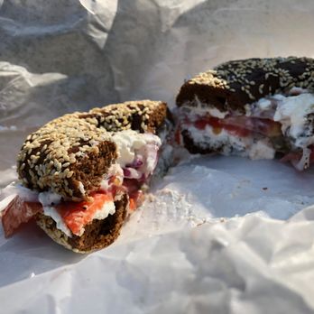 Bagel Time - a half eaten bagel with a bite taken out of it - Bagels Near Me - Toronto, Ontario