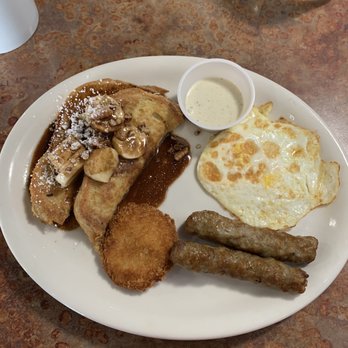 Huckleberry's - Banana foster, eggs, fried tomato and sausage. This is only a half portion. The server kindly split the meal between 2 plates. - Breakfast & Brunch Near Me - Sacramento, California
