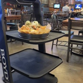 Amerisports - a pizza on a table - American Near Me - Kansas City, Missouri