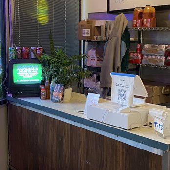 For The Win - Inside - counter and a JCVD movie about to play on the VCR TV - Burgers Near Me - Glendale, California