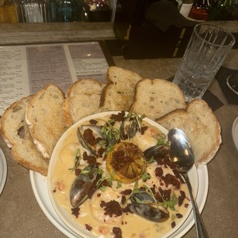 Luna Bistro Cafe - AMAZING shrimp and mussels with creamy sauce. So much bread and the little toppings I believe it a soyrizo or chorizo. So yummy - New American Near Me - Long Beach, California
