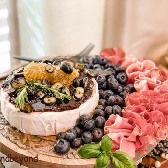 Brie & Beyond - Brie, the King of all cheeses. Lovely pairing with fig jam, blueberries, honeycomb, & prosciutto - Caterers Near Me